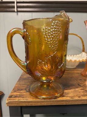 Carnival Indian Glass Grape & Leaf Footed Pitcher — Iridescent Amber